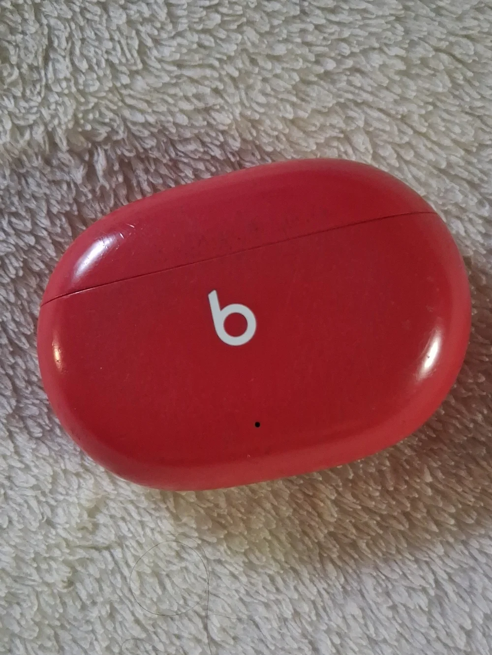 Beats wireless Ear Buds And Red Wireless Earbuds Charging Case